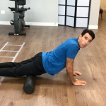 Using foam roller Person using a foam roller for physical therapy