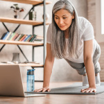 Person doing virtual workout Person doing a virtual workout session